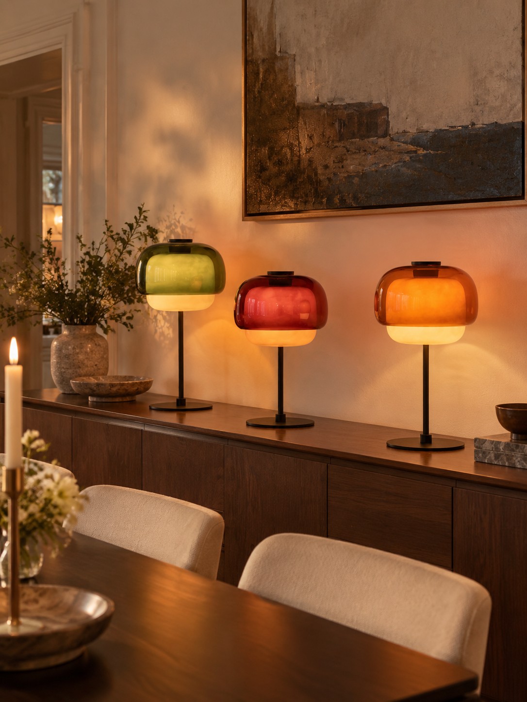 Three Pericles lamps lined on a dining sideboard