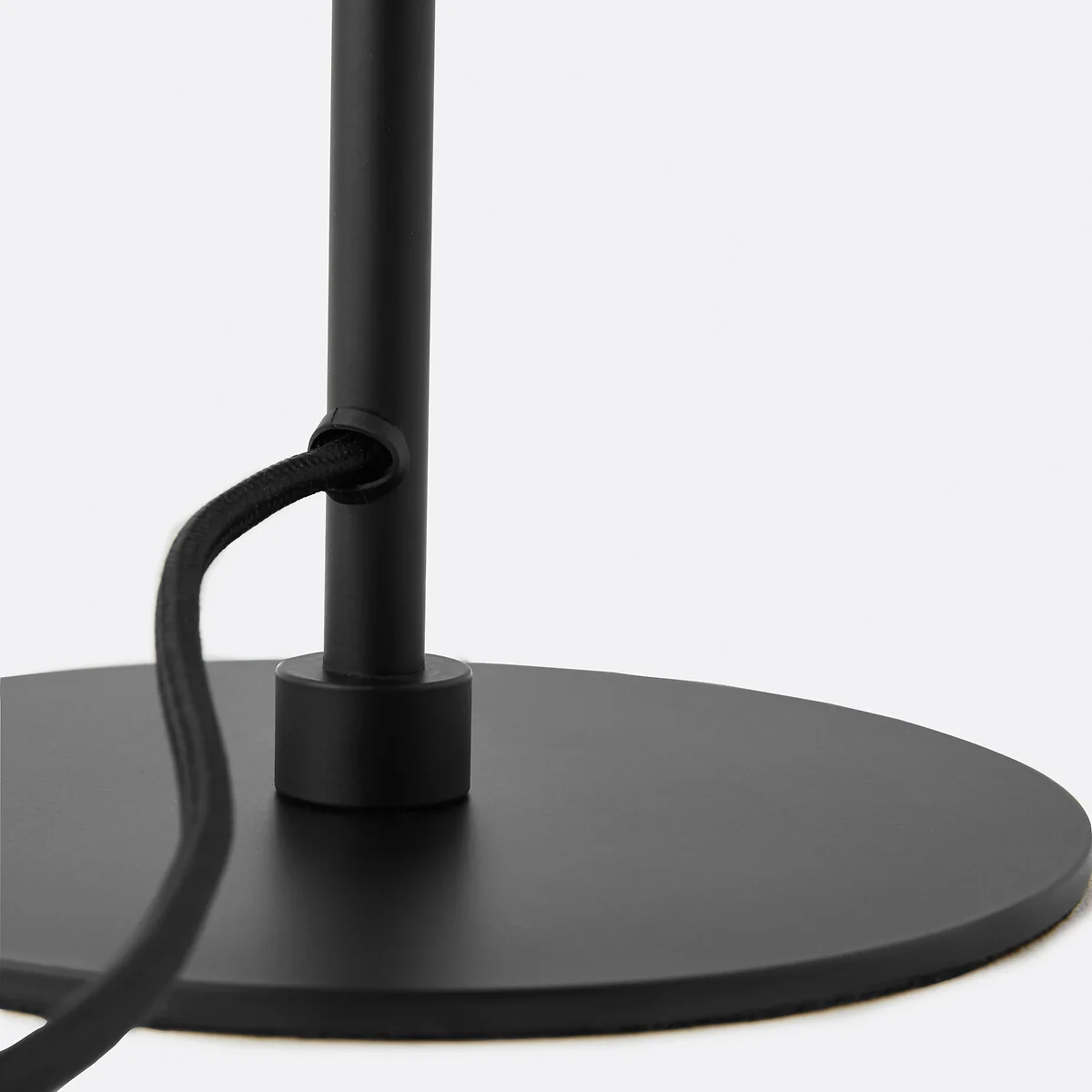 Matte black disc base and cord exit
