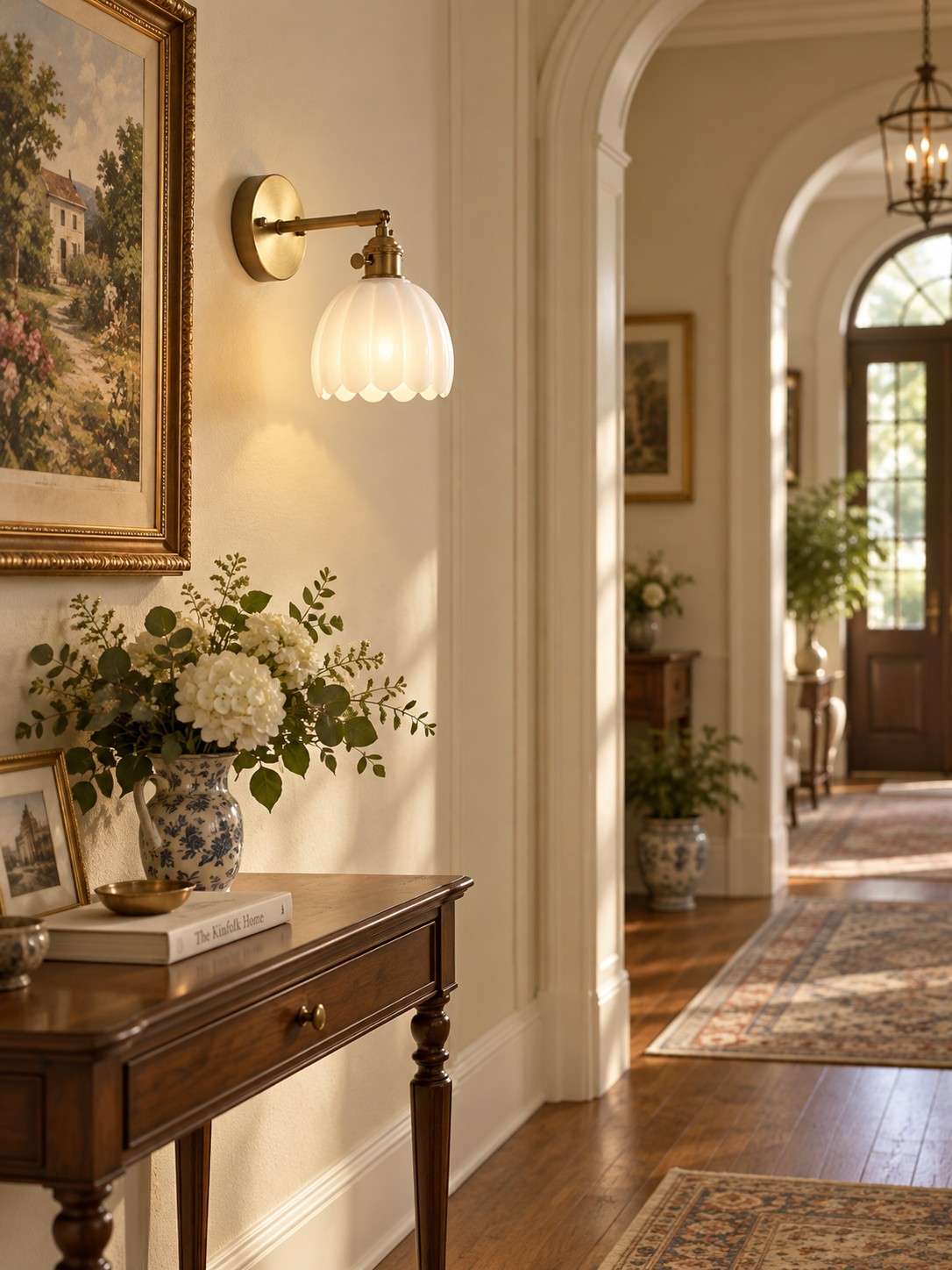 White glass tulip wall lamp above hallway console table